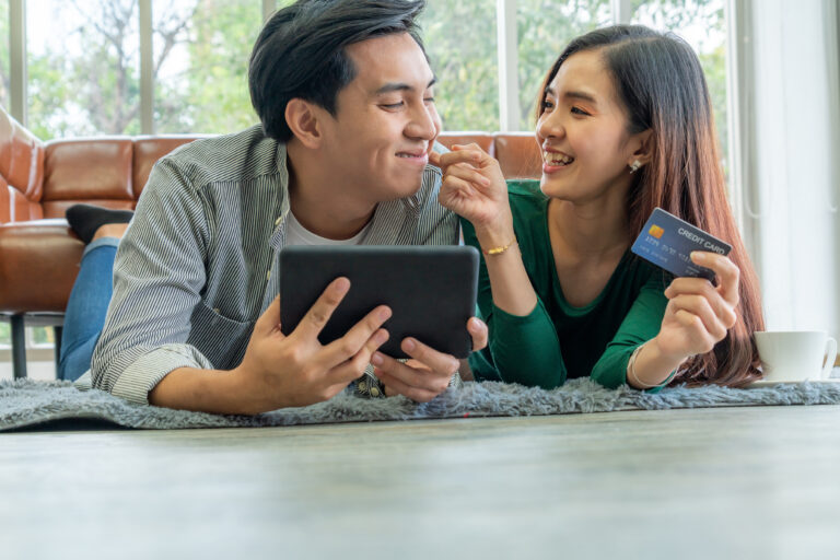 Young couple use credit card for online shopping